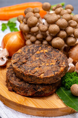 Tasty vegetarian food, burgers with champignons mushrooms, buna shimeji, carrot and onion