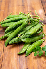 New harvest of ripe green peas legumes