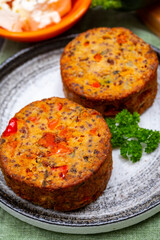 Tasty vegetarian food, burgers with Greek feta cheese, sweet red paprika, green olives and zucchini