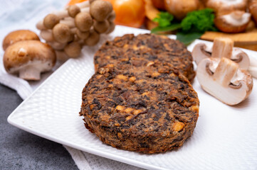 Tasty vegetarian food, burgers with champignons mushrooms, buna shimeji, carrot and onion