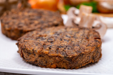 Tasty vegetarian food, burgers with champignons mushrooms, buna shimeji, carrot and onion