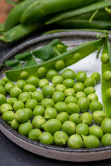 New harvest of ripe green peas legumes