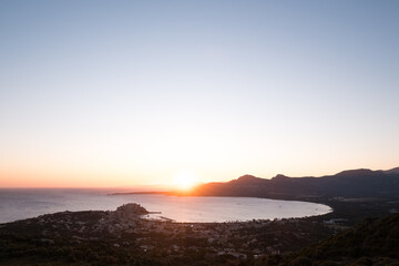 Fototapeta na wymiar Sunrise over Calvi Bay and citadel in Corsica