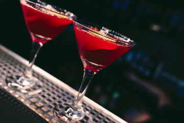 ice cold modern Cocktail  gourmet craft white with Sweet caramels decoration slice Author Drink - on bar counter . Close-up Top view . Copy paste space design barman people and luxury nightclub