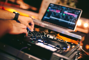 Overhead shot of Dj controling red party dj audio equipment.Turntable top view High quality mixing...