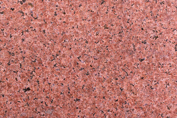 Granite wall for backdrop. Rough texture, color - shades of brown.
