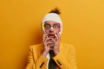 Photo of shocked scared man has swelling and bruising, needs much time for rehabilitation, abused...