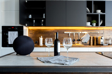 luxury studio apartment with a free layout in a loft style in dark colors. Stylish modern kitchen...