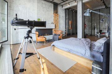 luxury studio apartment with a free layout in a loft style in dark colors. Stylish modern kitchen...