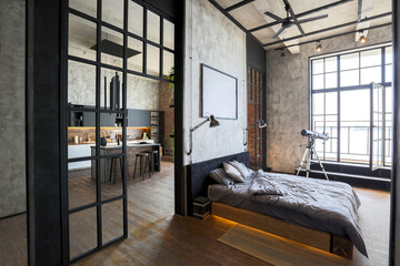 luxury studio apartment with a free layout in a loft style in dark colors. Stylish modern kitchen...