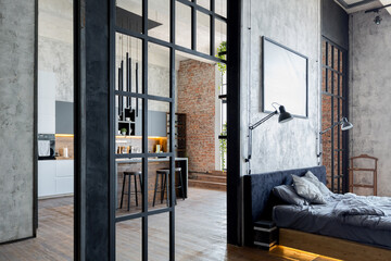 luxury studio apartment with a free layout in a loft style in dark colors. Stylish modern kitchen...