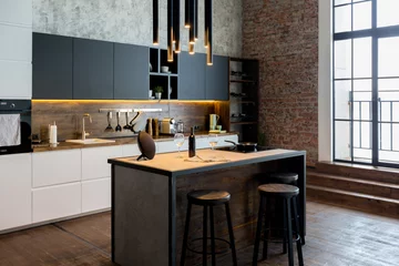 Poster luxury studio apartment with a free layout in a loft style in dark colors. Stylish modern kitchen area with an island, cozy bedroom area with fireplace and personal gym © 4595886