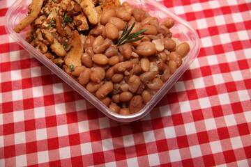beans and chicken  on a bowl