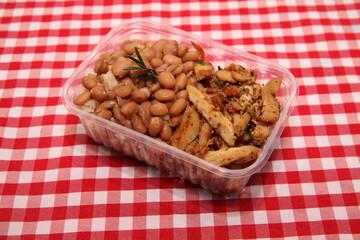 beans and chicken  on a bowl