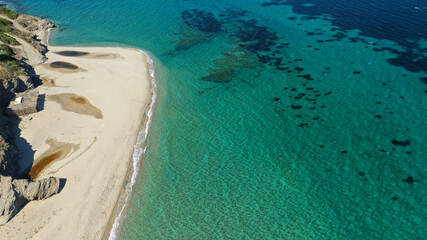 Aerial drone photo of famous big sand emerald sea beach or Megali Amos beach near seaside village of Marmari, South Evia island, Greece