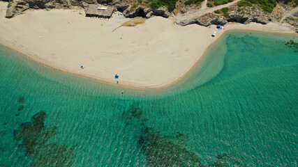 Aerial drone photo of famous big sand emerald sea beach or Megali Amos beach near seaside village of Marmari, South Evia island, Greece