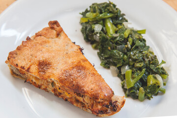 piece of pie and vegetables 