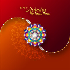 Decorated rakhi for Indian festival Raksha Bandhan Greeting Card ,indian festival with gold patterned and crystals on paper color Background.