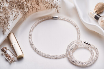 Woman fashion and beauty blogger products from above on white. 