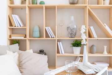 Luxury fashionable modern design studio apartment with a free layout in a minimal style. very bright huge spacious room with white walls and wooden elements. sitting area with fireplace