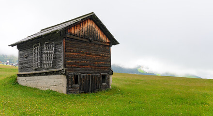 old wooden barn on a meadow at Eastern Tirol, Austria