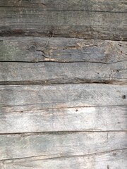Fence from the boards. The texture of the old boards. Wooden elements of the fence.
