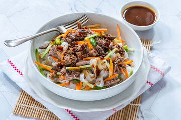 Oriental duck salad with rice noodles, vegetables and hoisin sauce