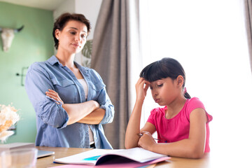 a mother not happy because her daughter does not do her school homework