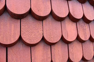wood coating the walls and the shingles and tiles