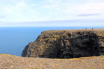 Cliff and sea and sky and horizon