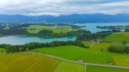 Fototapeta na wymiar Flight over the beautiful rural landscape of Bavaria Allgau in the German Alps. Aerial view