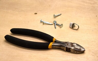 old rusty pliers and nails