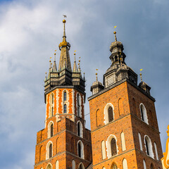 Fototapeta na wymiar It's Saint Mary's Basilica at the Market square in the Old town of Krakow, Poland