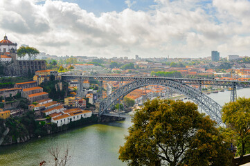 Fototapeta na wymiar Panorama of the Bridge Dom Luis I over the River Douro in Porto, Portugal