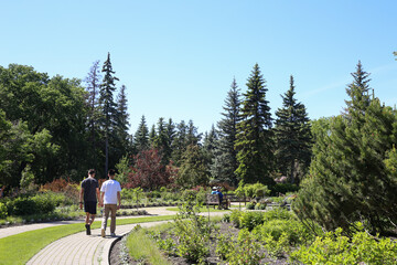 Winnipeg, Manitoba / Canada - June 13, 2020: Friends hiking at Assiniboine Park.