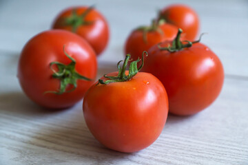 top view of red tomatoes on wooden table