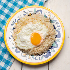 Fried egg with rice on white background