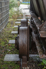 Fototapeta na wymiar Wheels on old and disused ore cart.