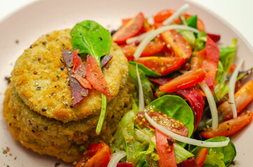 Smoked haddock fishcake with melting cheddar sauce and mixed salad