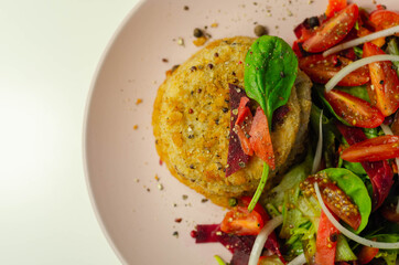 Smoked haddock fishcake with melting cheddar sauce and mixed salad