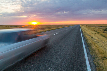 Sunset view of a road in russian steppe