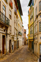 Fototapeta na wymiar Narrow street of the Historic center of Coimbra, Portugal. World Heritage site by UNESCO since 2013