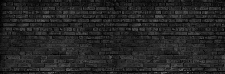 Background Of Old Vintage Dirty Dark Black Brick Wall With Peeling Plaster. Shabby Building Facade....