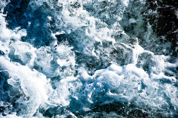 blue foamy crashing waves