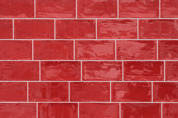 Generic seamless old metro style glazed dark red tiled background texture shot straight on.