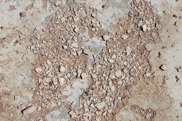 Destroyed old concrete, small stones are visible