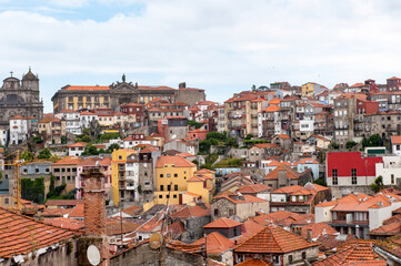 Fototapeta na wymiar It's Beautiful cityscape of Porto and the Clerigos Church belltower. Porto is the second largest city in Portugal and it was called the European Culture Capital in 2001