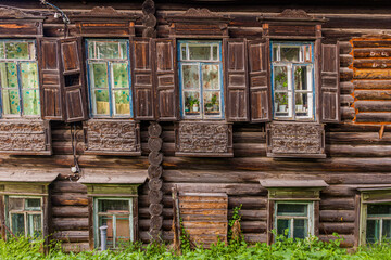 Windows of the typical old Russian wooden house in Tyumen city, Russia
