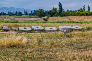 Ancient millstones near the Burana tower, Kyrgyzstan