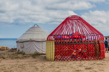 ISSYK KUL, KYRGYZSTAN - JULY 15, 2018: Traditional yurt under construction at the Ethnofestival Teskey Jeek at the coast of Issyk Kul lake in Kyrgyzstan